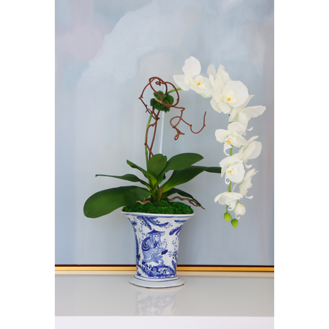 White Orchid in Wise Monkey Vase